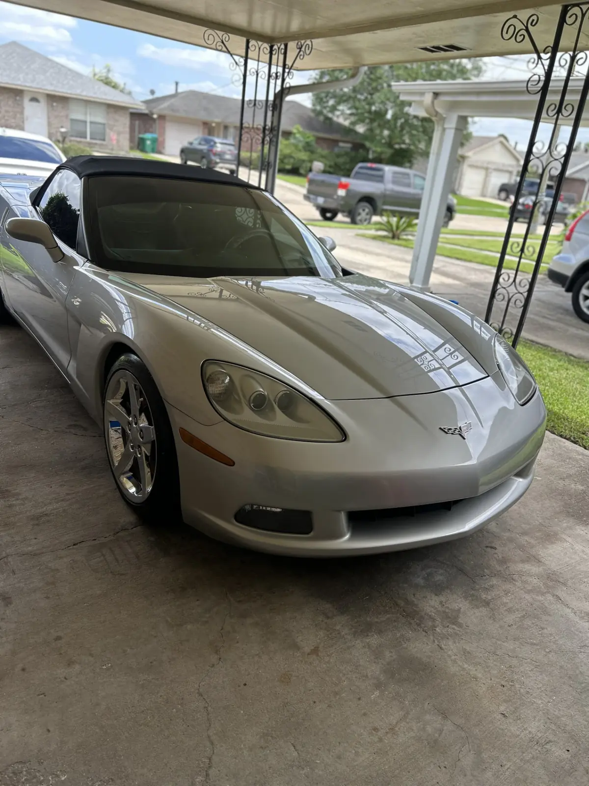 Silver Chevrolet Corvette convertible with a mirror-gloss finish after a two-stage paint correction in Kenner, Louisiana